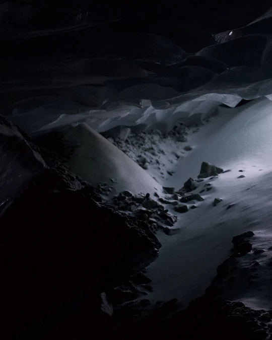 Slide 6: Left section of a dark ice cavern and snowy floor