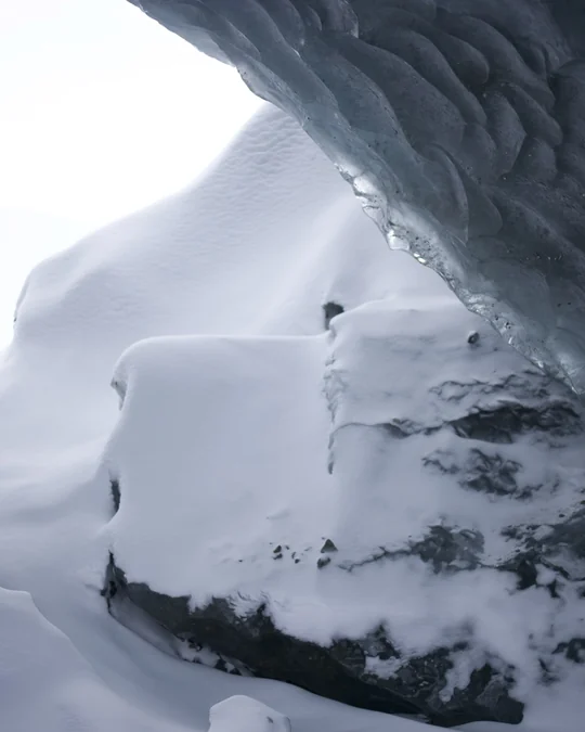 A bright snowy opening framed by the glacier